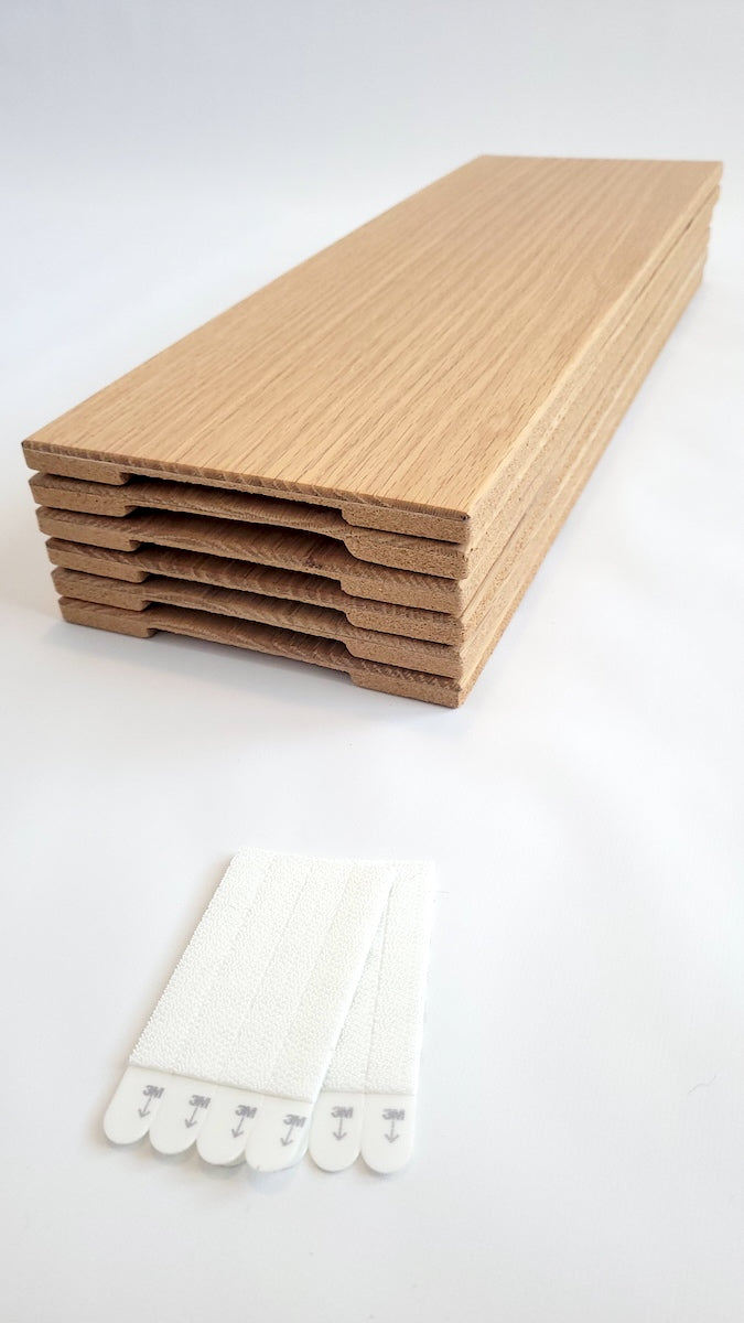 TALAYA Solid Ground tile set of 6 in Honey Oak finish, stacked, on white background, with included adhesive picture hangers