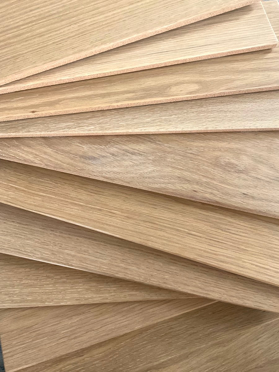 TALAYA Solid Ground Honey Oak tiles spread in an overlapping cascading line