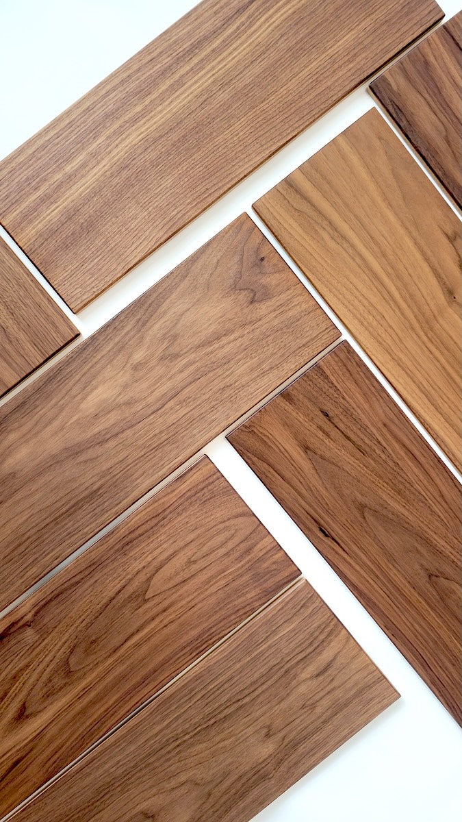 TALAYA Solid Ground Walnut Mocha tiles arranged at 45-degree angles in alternating diagonal directions, interlocking freeform layout on white background