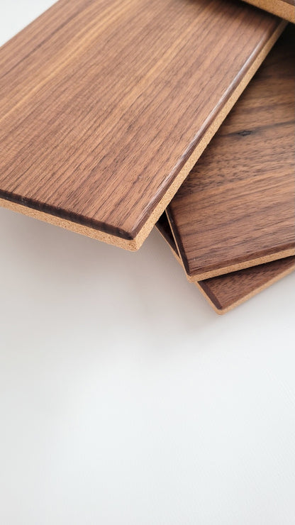 TALAYA Solid Ground tiles in Walnut Mocha finish, artfully stacked in corner detail shot with negative space