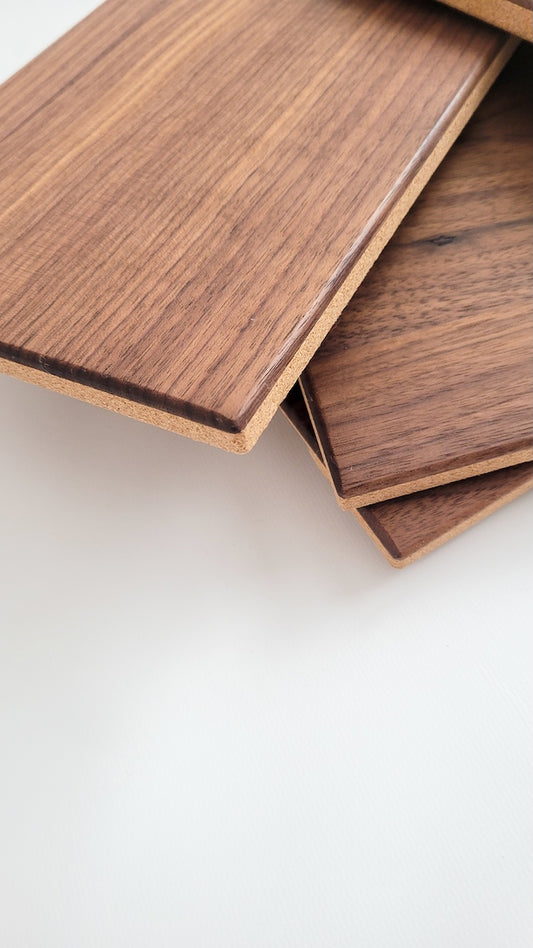 TALAYA Solid Ground tiles in Walnut Mocha finish, artfully stacked in corner detail shot with negative space